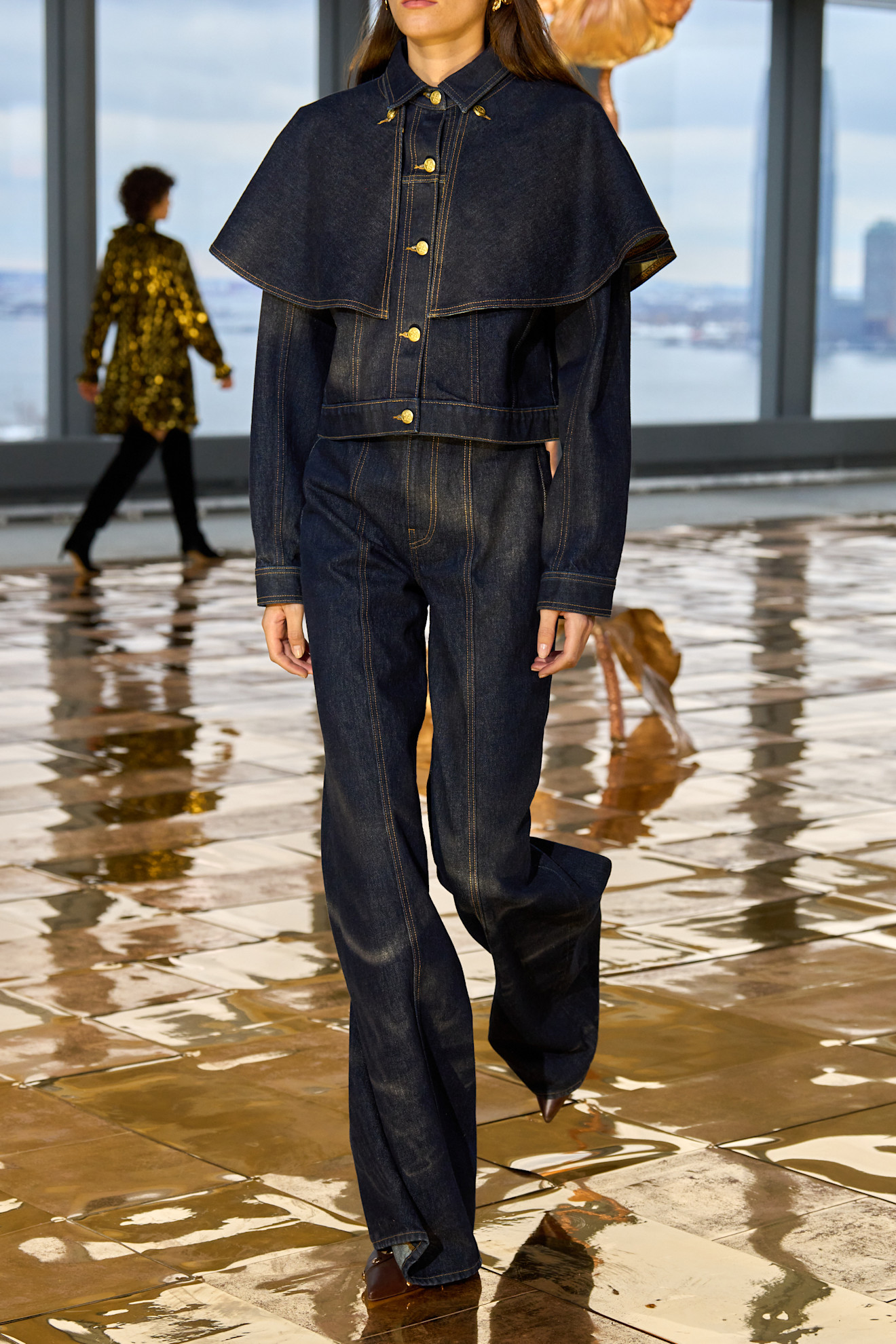 Woman in dark wash denim jacket and jeans