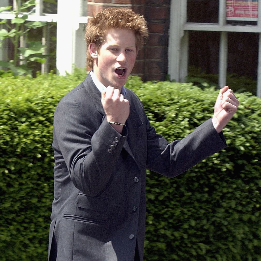 WINDSOR, ENGLAND - JUNE 12: (FILE PHOTO) Prince Harry clenches his fist as he leaves Eton College on June 12, 2003 in Windsor, England. The Royal Family on October 9, 2004 denied allegations that the Prince had cheated in his art A-level. Sarah Forsyth, a former teacher of Harry at Eton, made the allegations as she prepared to take the college to an industrial tribunal claiming unfair dismissal. (Photo by Anwar Hussein/Getty Images) 