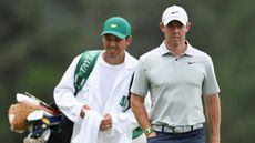 Rory McIlroy and his caddie at the 2023 Masters