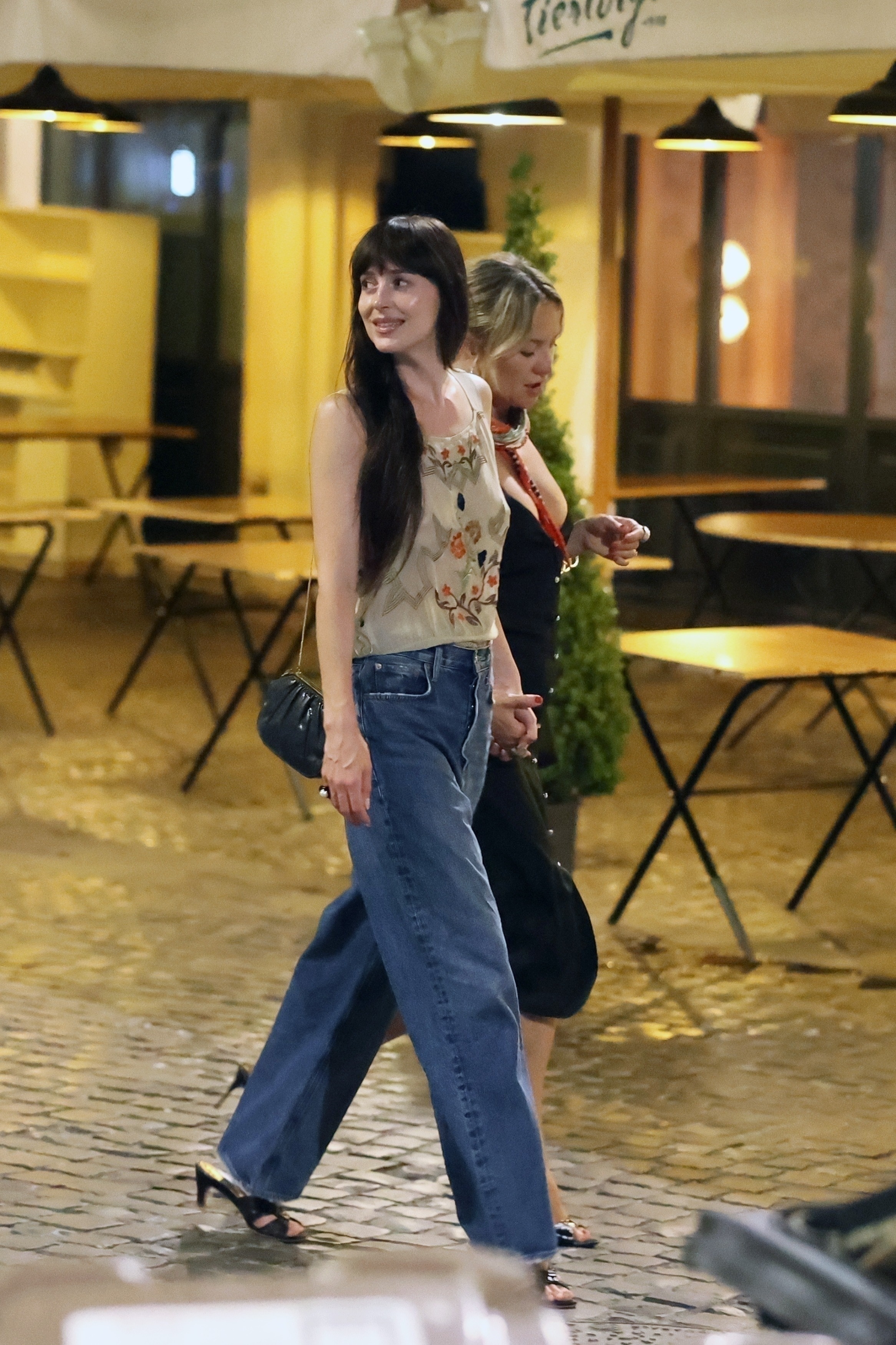 Dakota Johnson and Kate Hudson were spotted hand-in-hand in Rome