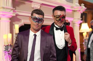 Married couple James and Ste at the ball with their masks on.