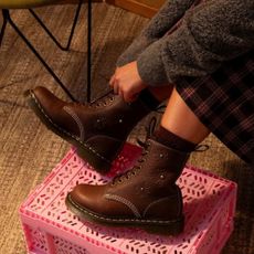 Brown Dr Martens boots with flower detail