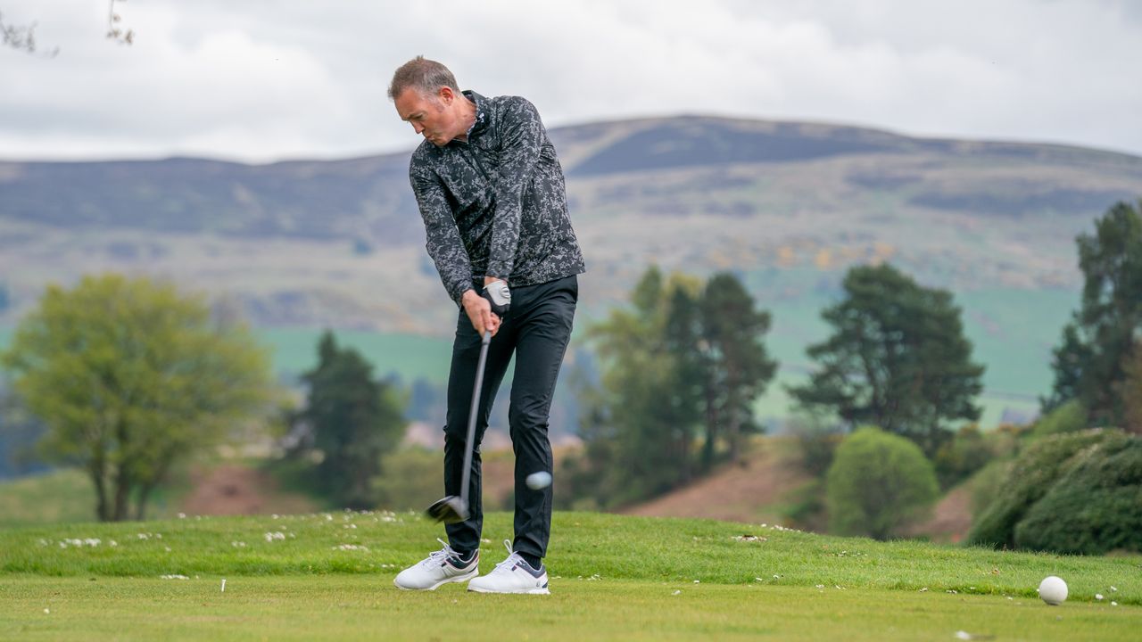 A golfer hitting a drive at Gleneagles Golf Club