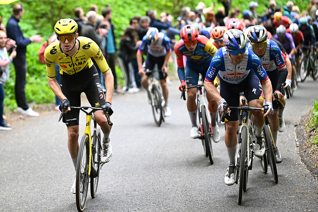 Matteo Jorgenson rides to the left of a group