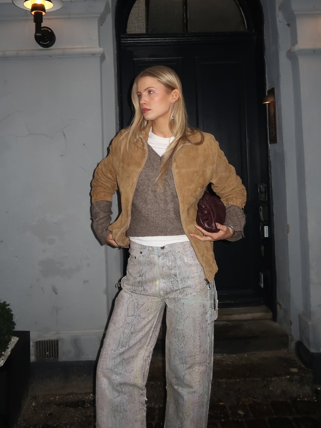 Woman wearing layering outfit idea 2026.