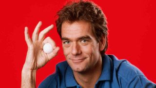 Huey Lewis posing for a photograph in 1985
