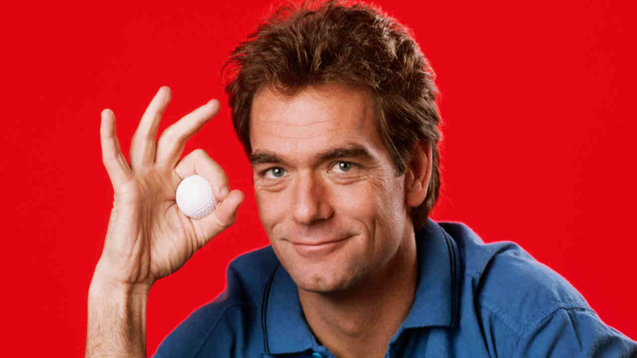 Huey Lewis posing for a photograph in 1985
