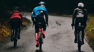 Three riders in winter kit riding the Rapha Festive 500