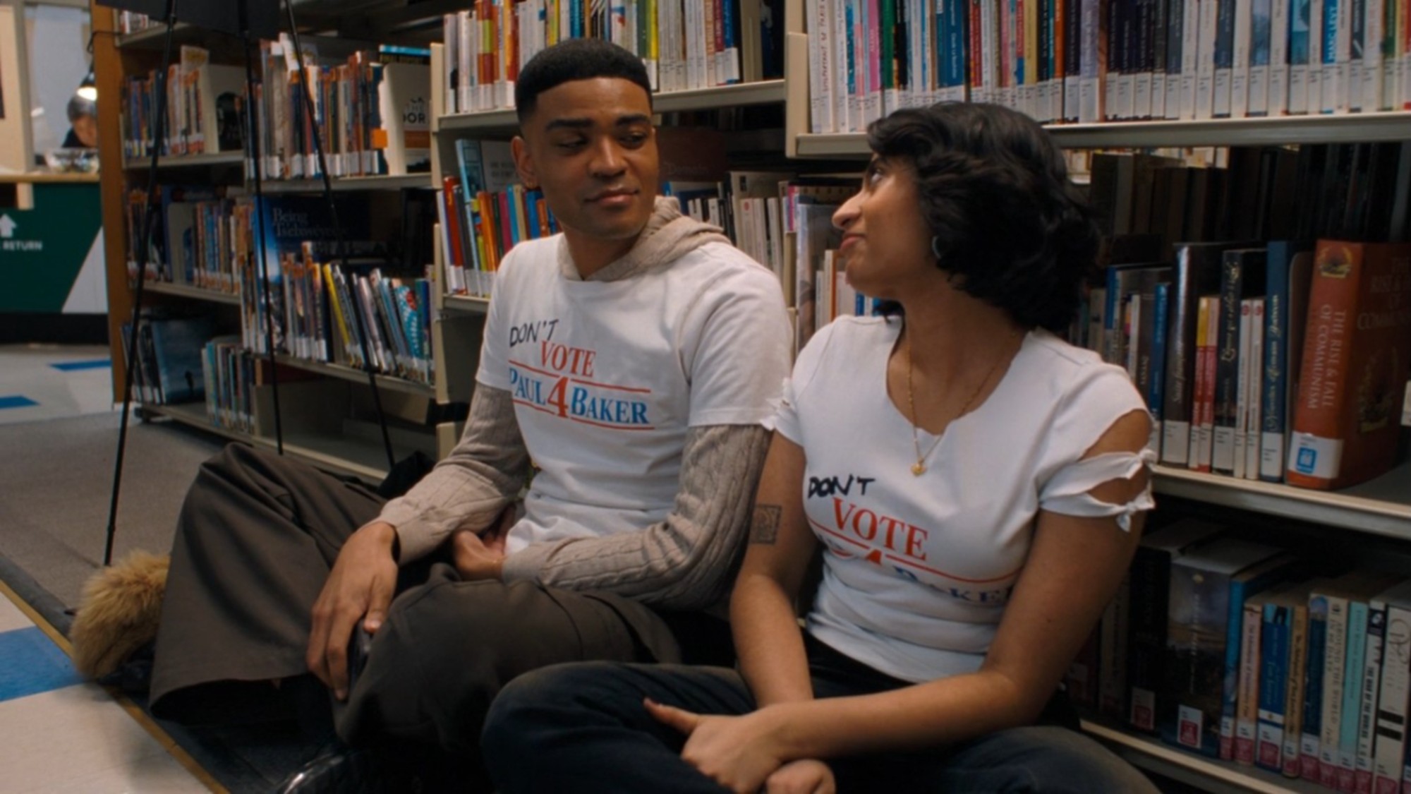 Amita Rao and Owen Thiele looking at each other in Adults.