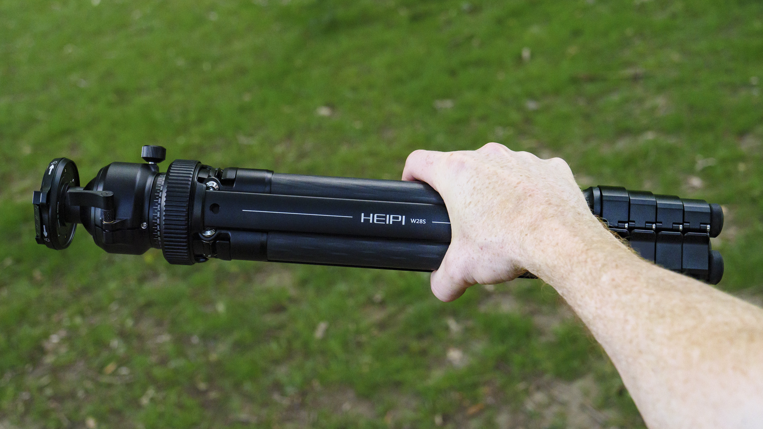 Heipi 3-in-1 Travel Tripod W28S folded away, in the hand