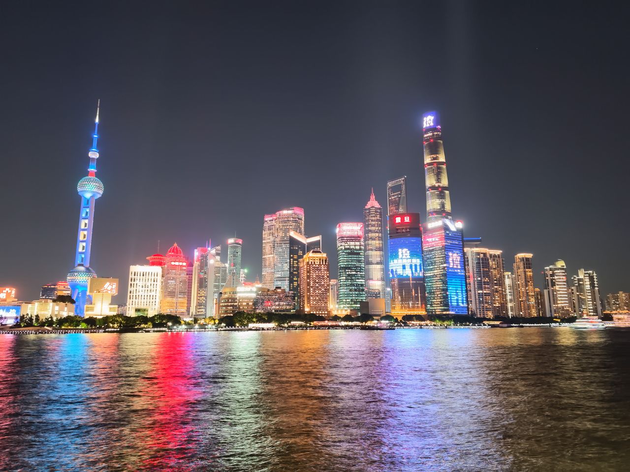 The famous Bund skyline over the Haungpu river in Shanghai, at night