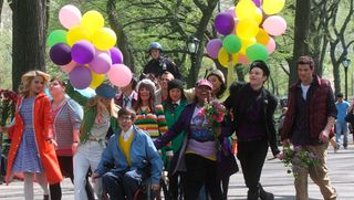 The Glee cast stroll through a park holding balloons