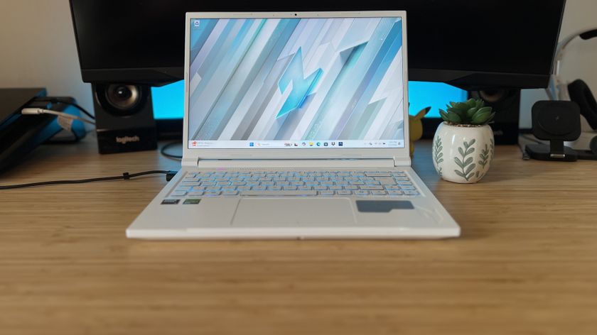 Acer Nitro V 14 gaming laptop on a wooden desk