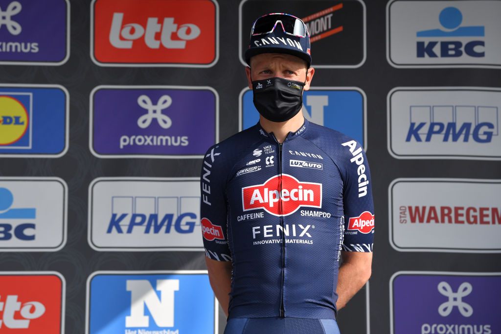 WAREGEM BELGIUM MARCH 31 Podium Tim Merlier of Belgium and Team AlpecinFenix Celebration during the 75th Dwars Door Vlaanderen 2021 Mens Elite a 1841km race from Roeselare to Waregem Mask Covid safety measures DDV DDV21 FlandersClassic A travers la Flandre on March 31 2021 in Waregem Belgium Photo by Luc ClaessenGetty Images