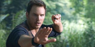 Jurassic World Chris Pratt puts his hand out to stop dinosaur Universal Pictures