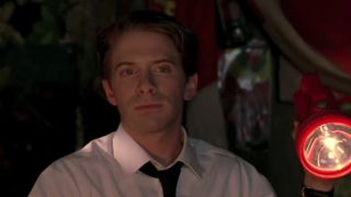 Seth Green in a white shirt and black tie in Without a Paddle
