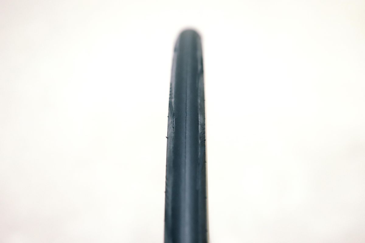 a close up of a black road bike tyre