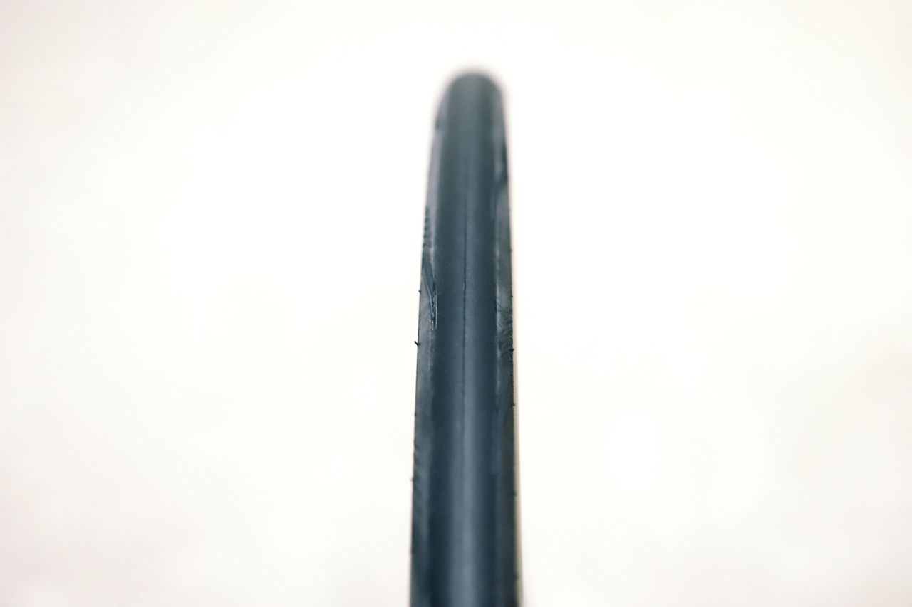 a close up of a black road bike tyre