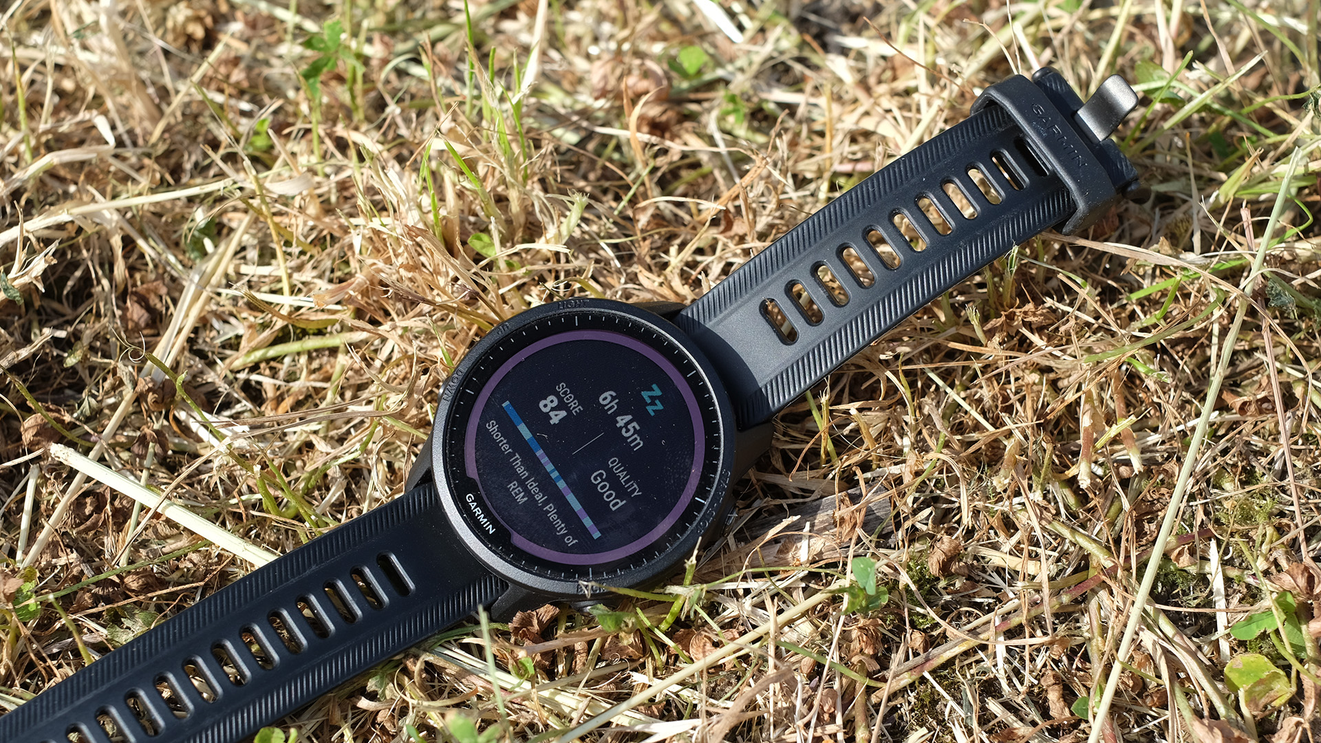 Garmin Forerunner 955 sleep display with grass background.