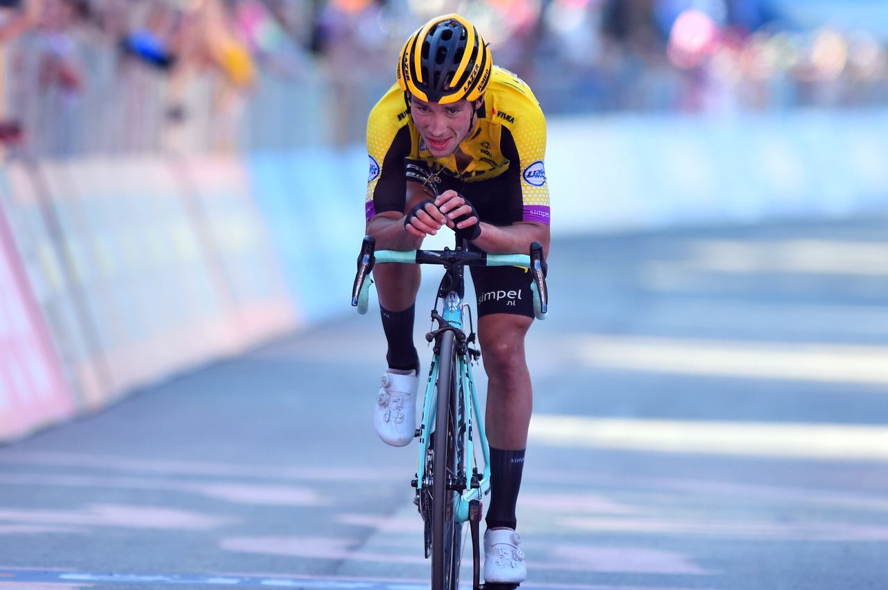 Primoz Roglic crosses the line, having shed time to Mikel Landa