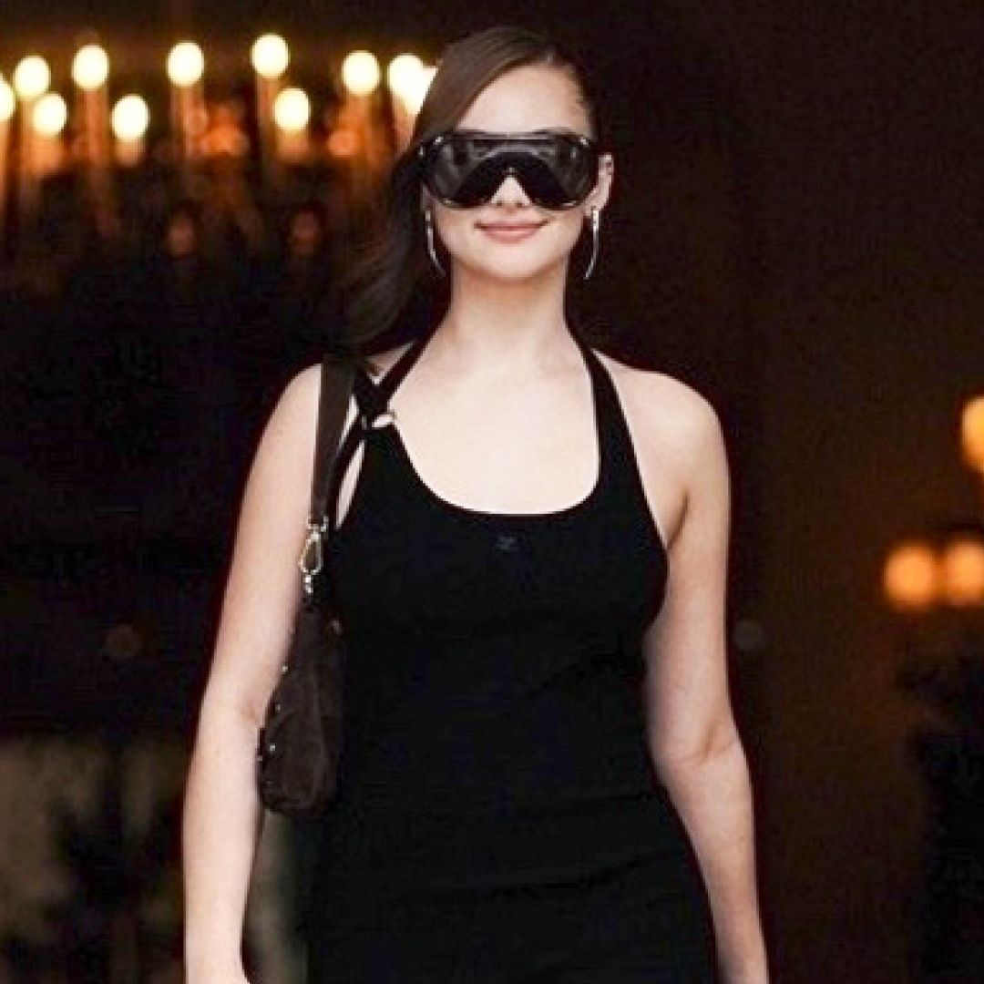 Lola Tung was spotted in Paris wearing an anti-Belly little black dress and leather legging boots