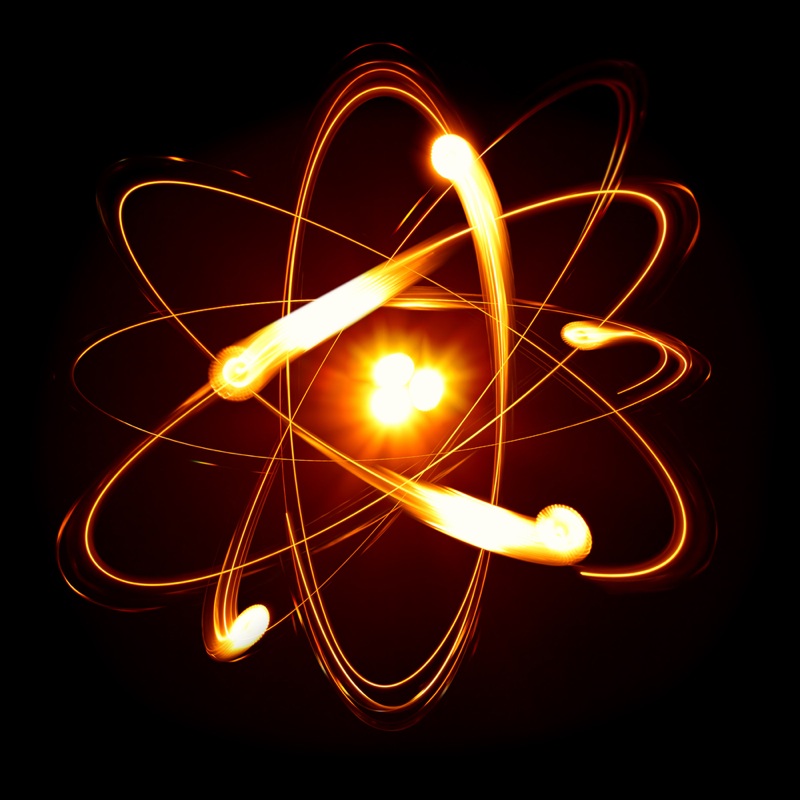 an atom with electrons zipping around
