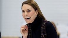 Catherine, Princess of Wales laughs while participating in curling at the National Curling Academy on January 20, 2026