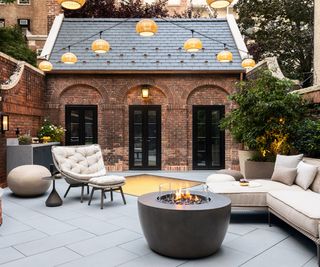 back yard with fire pit and white outdoor furniture