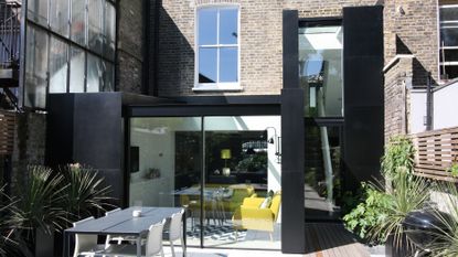 Black box extension to London terrace clad with metal from IQ Glass