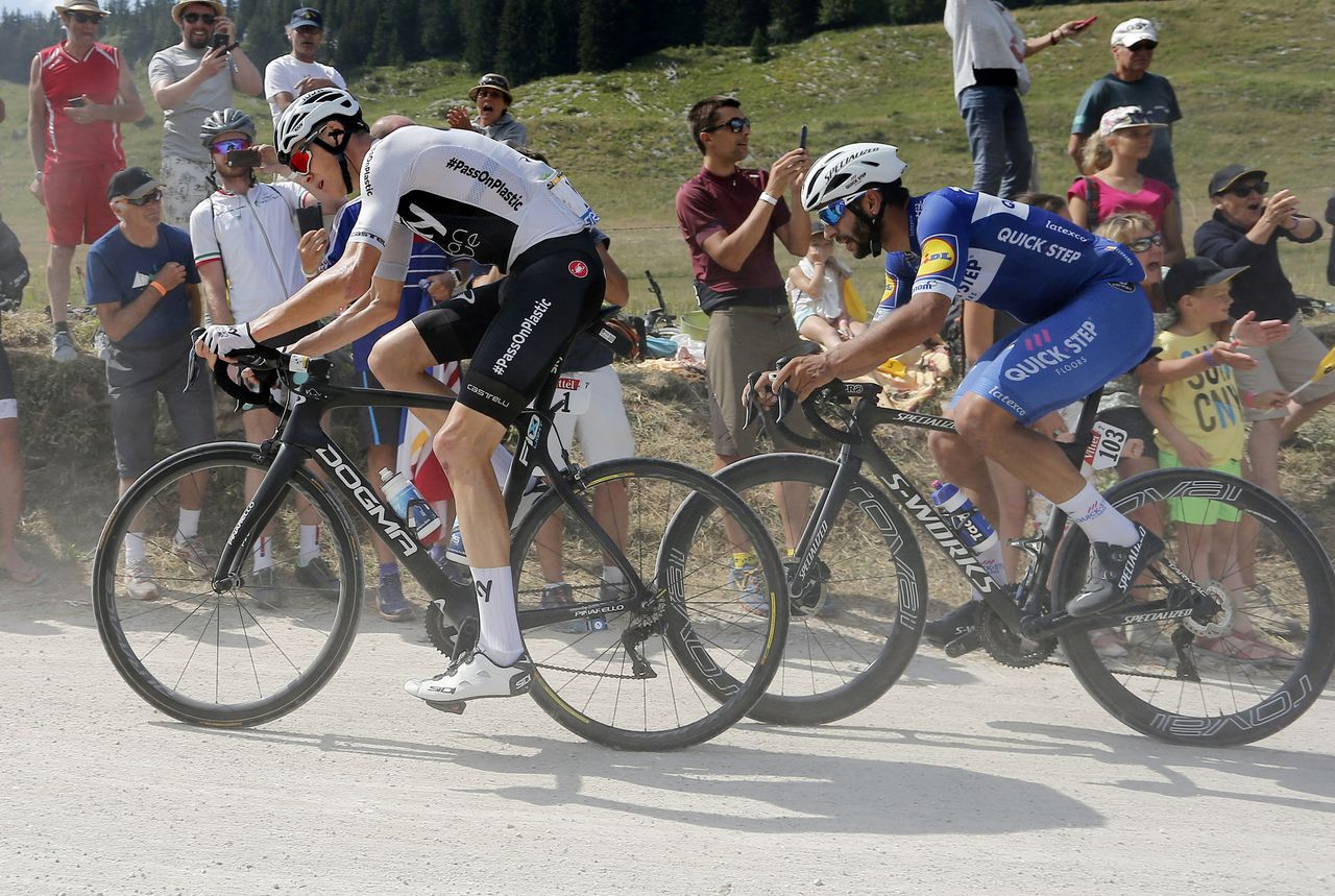 Chris Froome chases back from his puncture