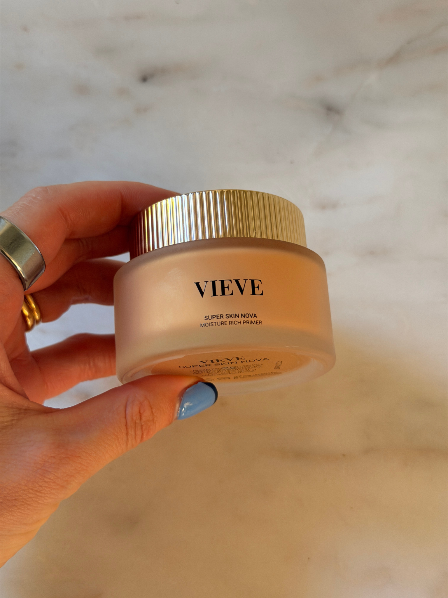 Freelance beauty editor Grace Day holding the Vieve primer.