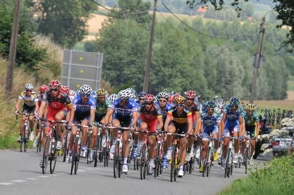 The peloton roll out at an easy pace