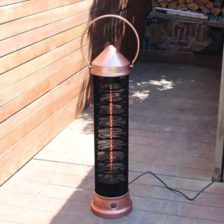 The Kettler Kalos copper lantern patio heater being tested on wooden decking