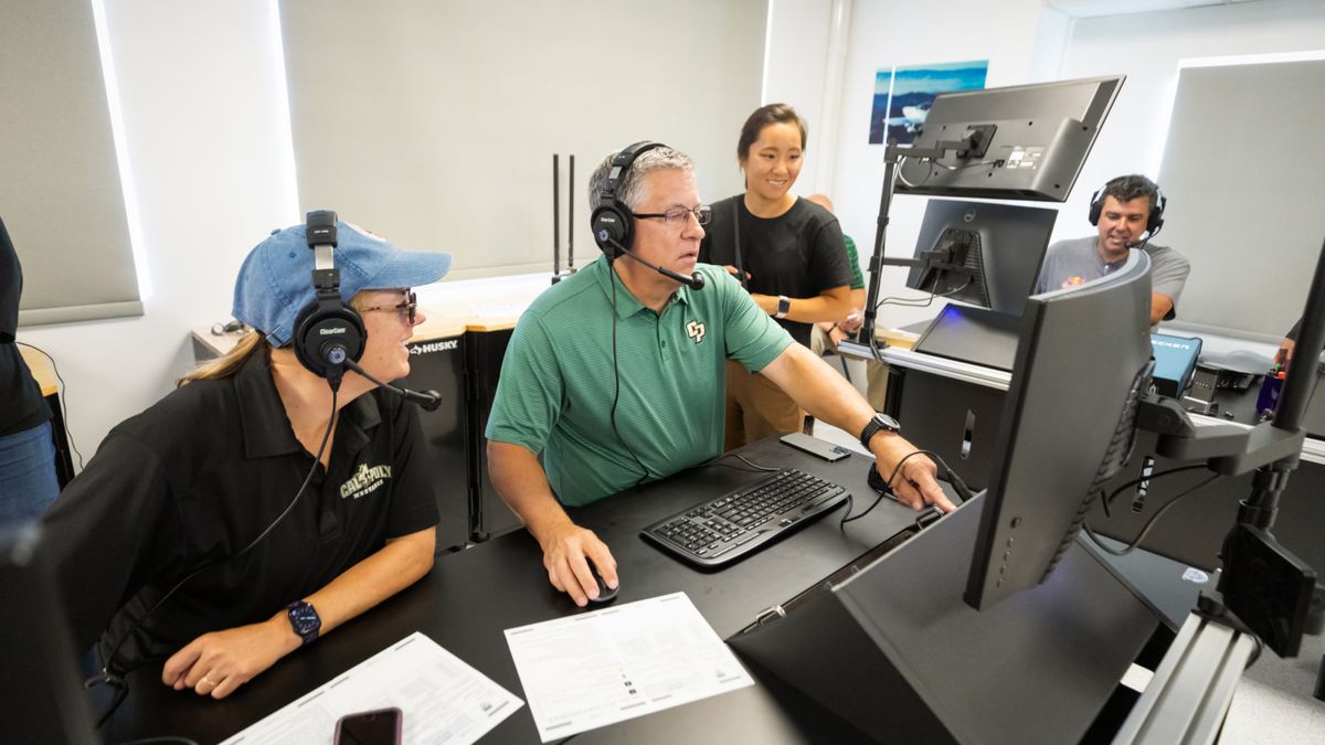 Three people working at Cal Poly Aerospace Engineering Program.