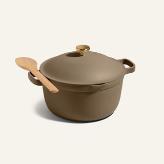 perfect pot in tierra with a wooden spoon balancing on top