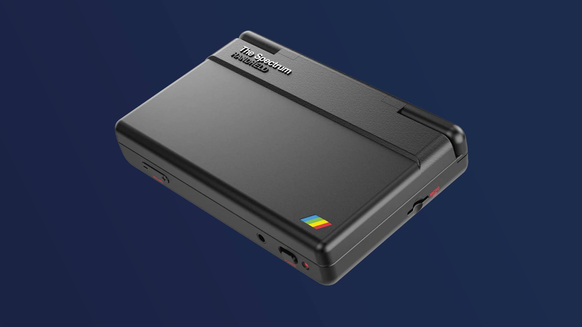 The Spectrum Handheld with clamshell closed on blue backdrop.