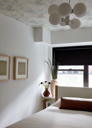 bedroom with ceiling wallpaper