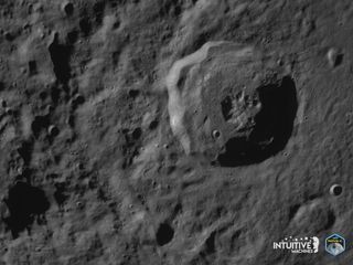 a close-up of the lunar surface showing a crater