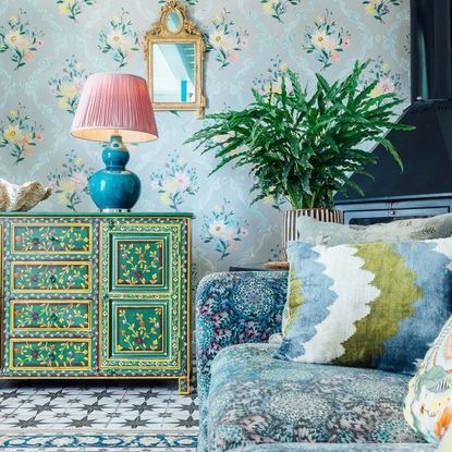 A blue and green living room with a pattern drenched finish