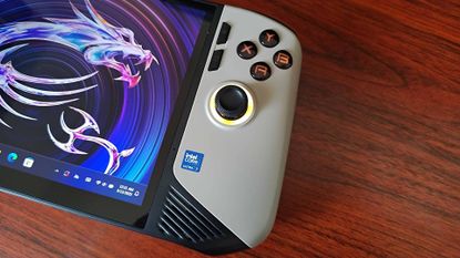 Close up of MSI Claw 8 AI+ handheld on woodgrain desk.