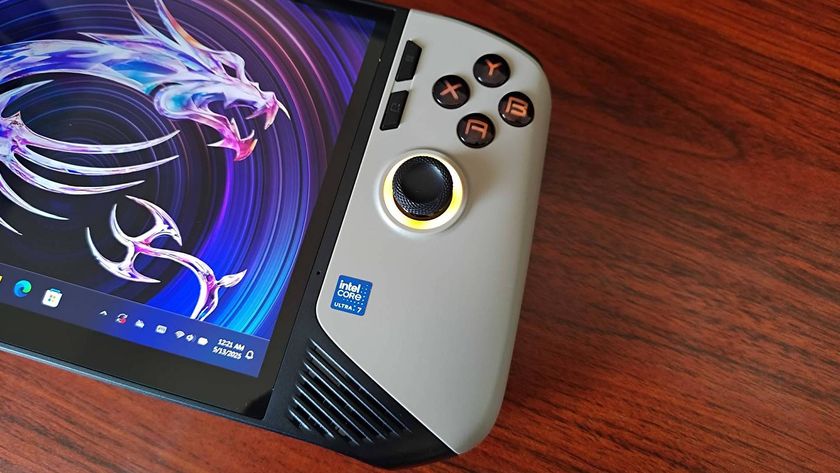 Close up of MSI Claw 8 AI+ handheld on woodgrain desk.