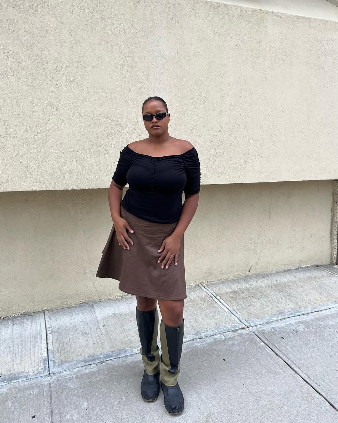 Woman wearing boatneck top.