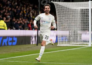 Manchester City’s Bernardo Silva celebrates scoring their side’s third goal of the game during the Premier League match at Vicarage Road, Watford. Picture date: Saturday December 4, 2021