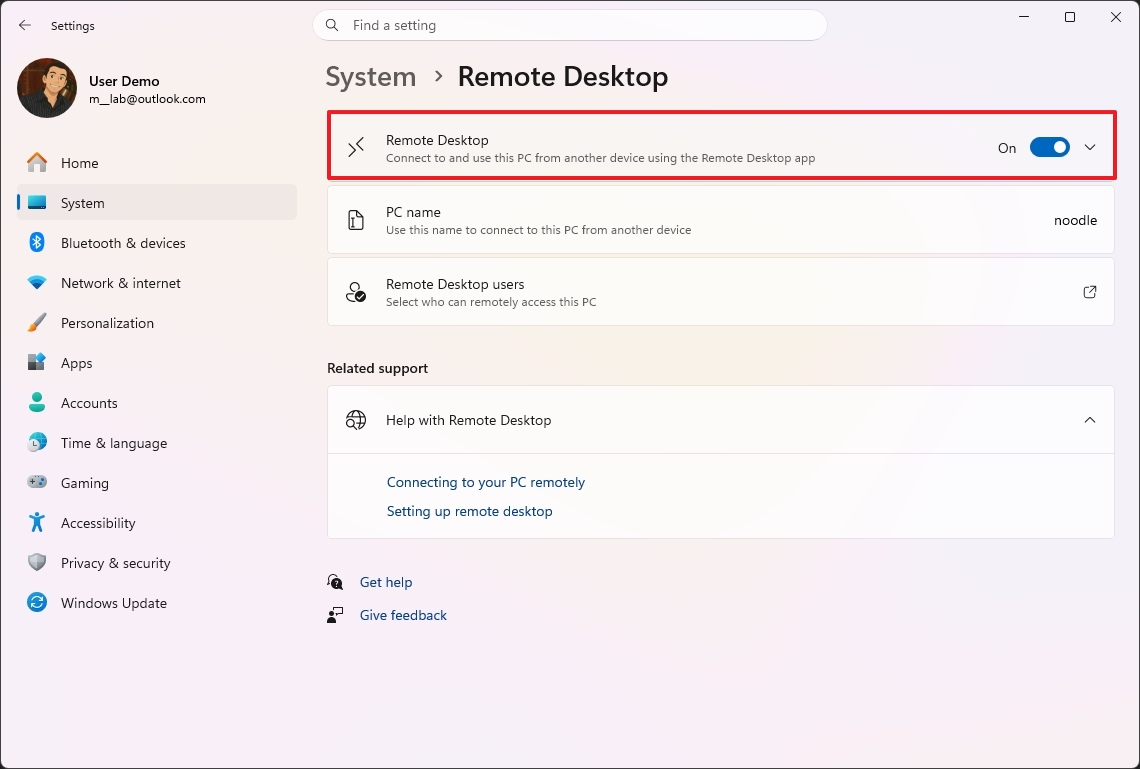 Remote Desktop settings screen showing options like PC name and Remote Desktop users. The Remote Desktop feature is toggled on.