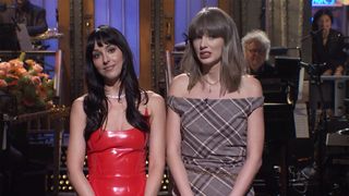 Dakota Johnson in red latex and Taylor swift in plaid on SNL stage during monologue October 2026.