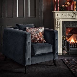 best carpet colour for living room, black living room with dark grey armchair, fire lit, black/charcoal carpet