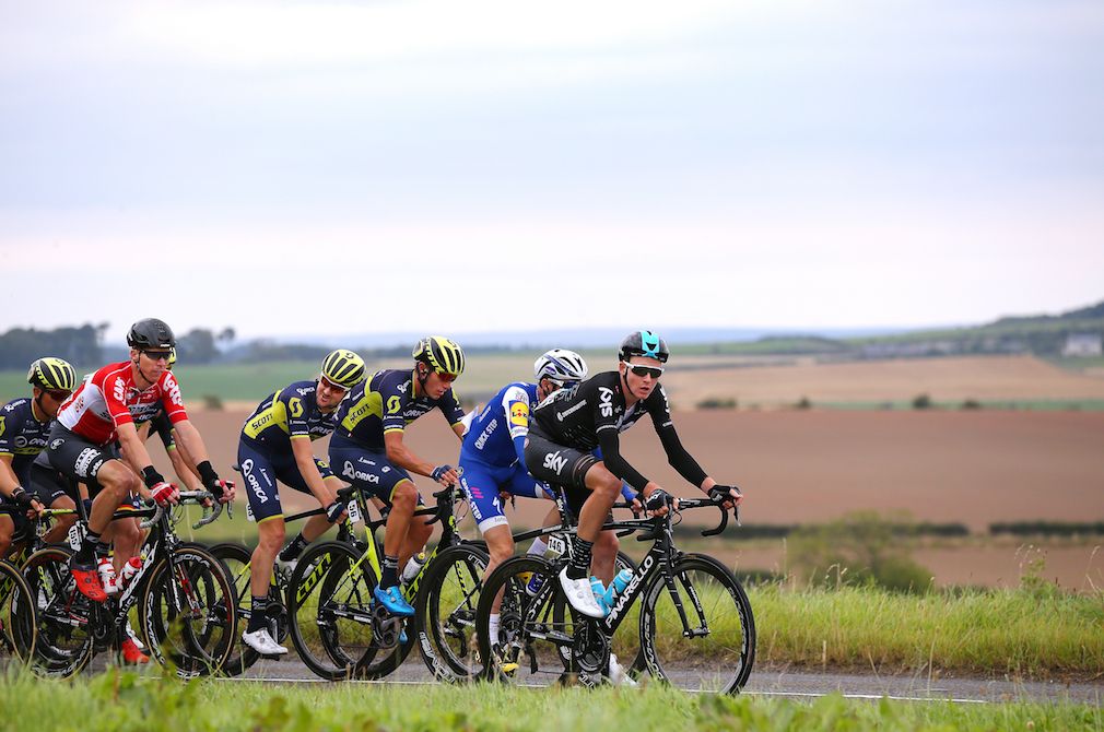 Several teams sharing pacing duty at the front of the Tour of Britain peloton