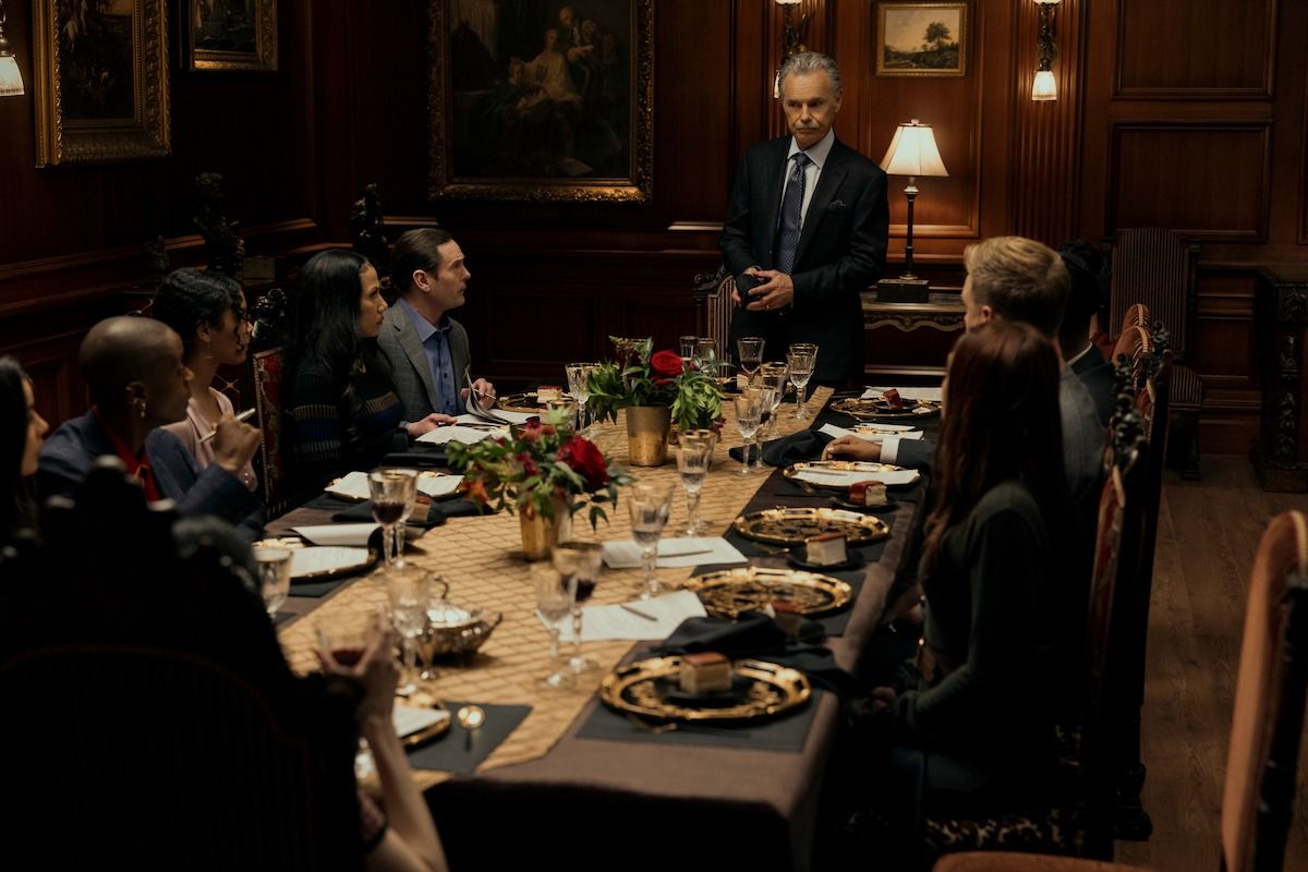 The Fall of the House of Usher cast sitting around a dinner table