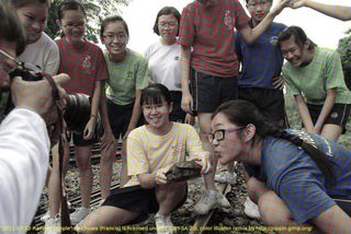 A seemingly colour photo of a group of teenagers.