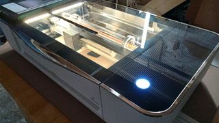 Glowforge Pro; a photo of a laser cutter on a table